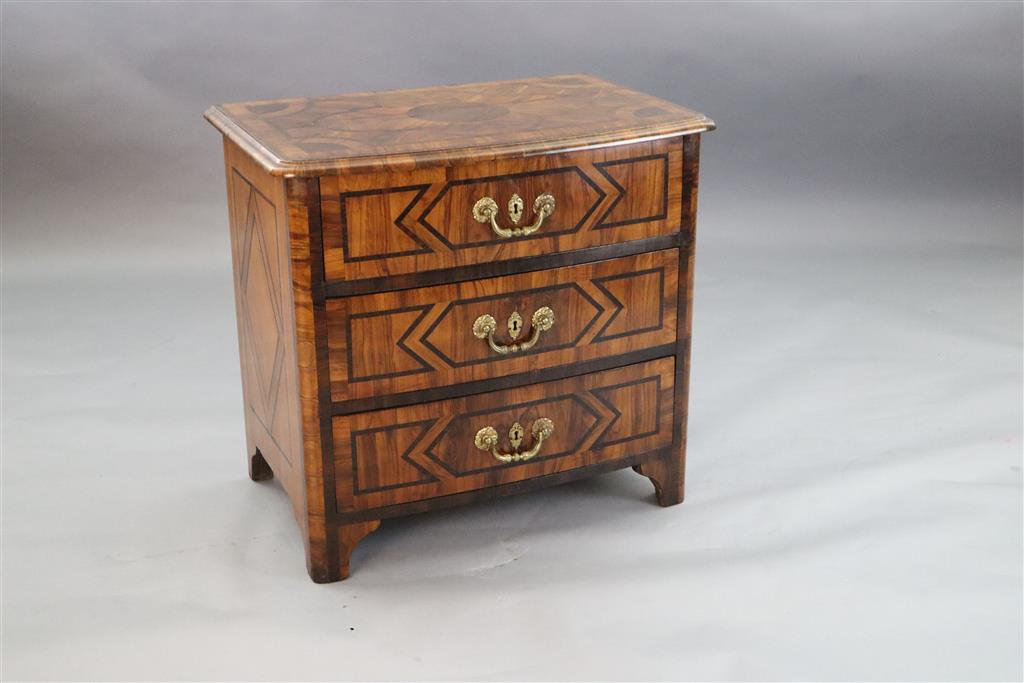 A French Regence olivewood and rosewood bowfront commode, c.1725, W.2ft 8in. D.1ft 9in. H.2ft 6in.